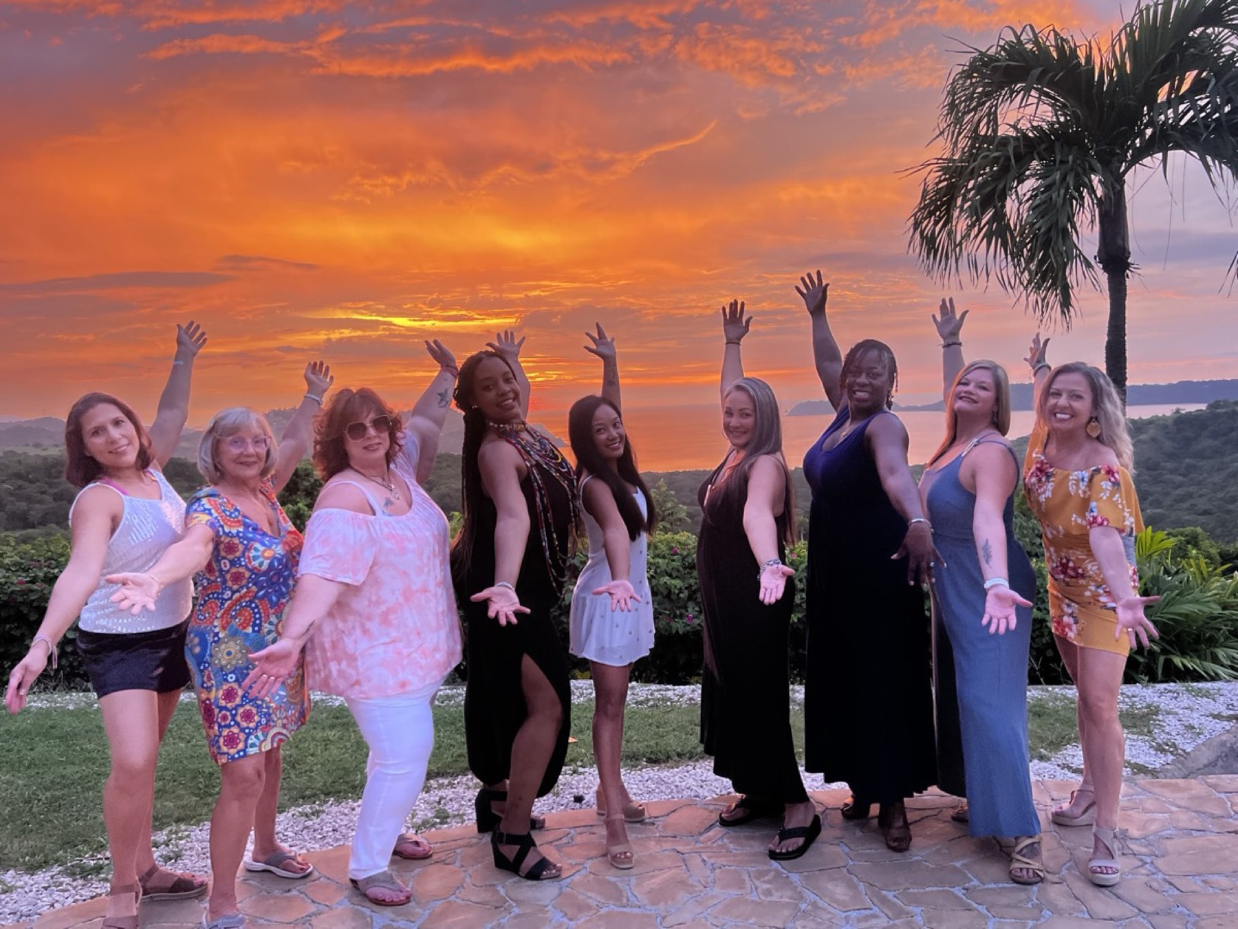A retreat group together at sunset
